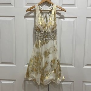 White and gold dress by Camille La Vie
